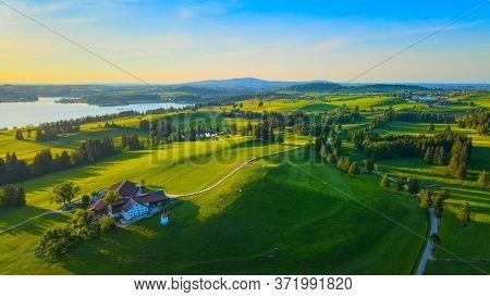 Aerial View Over Lake Forggensee At The City Of Fuessen In Bavaria Germany