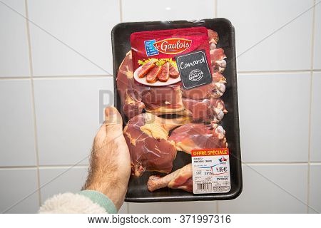 Paris, France - Mar 21, 2029: Man Hand Holding Fresh Duck Meat Box Special Offfer Or 4, 86 Euros Man
