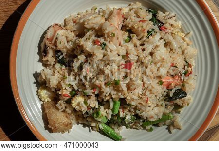 Homemade Holy Basil And Spicy Herb Fried Rice With Shrimps, Squid And Yardlong Bean. Thai Stir Fried