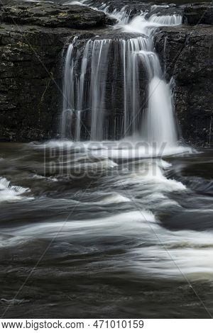 Beautiful Peaceful Landscape Image Of Aysgarth Falls In Yorkshire Dales In England During Winter Mor