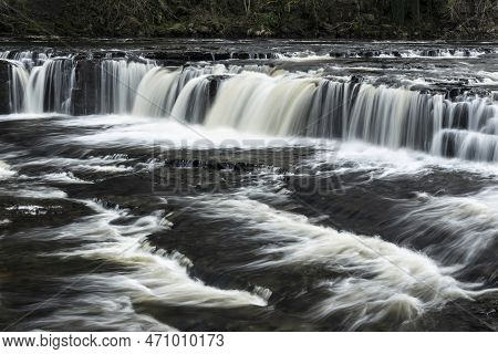 Beautiful Peaceful Landscape Image Of Aysgarth Falls In Yorkshire Dales In England During Winter Mor