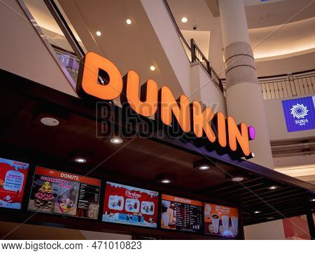 Kuala Lumpur, Malaysia - December 04, 2022: Dunkin Donut Brand Retail Shop Logo Signboard On The Sto