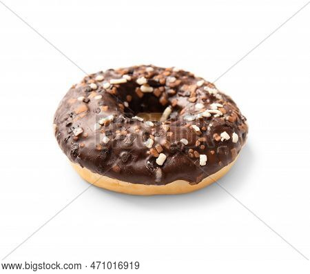 One Donut In Chocolate Glaze Sprinkled With Pieces Of White, Milk And Dark Chocolate Isolated On A W