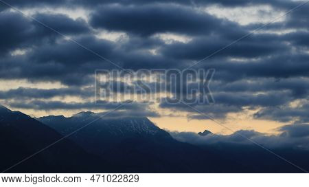 Dark Clouds Over Mountains Seen From Interlaken, Switzerland.