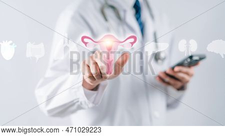 Doctor In A White Coat Touching Virtual Uterus Reproductive System , Woman Health, Pcos, Ovary Gynec