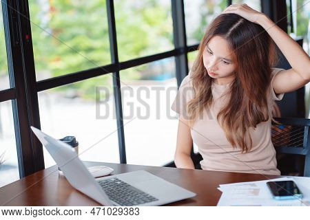 Asian Woman Having Neckache During Working With Laptop Computer In Office, Business Woman Work Hard 