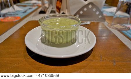 Pudina Dahi Chutney Or Mint Yoghurt Dip Kept In Glass Bown Ready For Serving With Tikka And Barbecue
