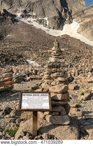 Large Cairn And Warning Sign Below Longs Peak In Rocky Mountain National Park