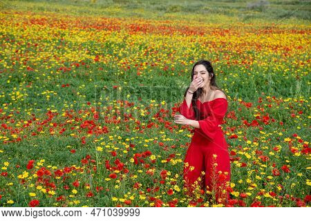 Beautiful Young Woman Smiling In The Poppy Flower Spring Field. Blooming Spring Time Season , Cyprus