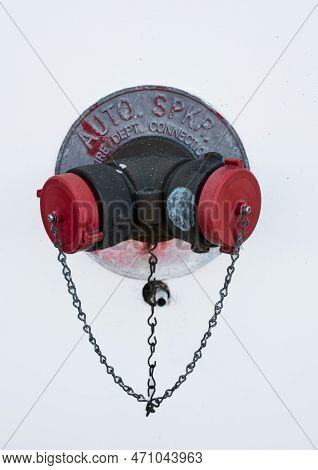 Auto Sprinkler Standpipe Connector. Fire Department Connection Covered Outside Of A Building On A Wa