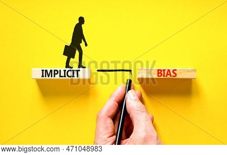 Implicit Bias Symbol. Concept Words Implicit Bias On Wooden Block. Beautiful Yellow Table Yellow Bac