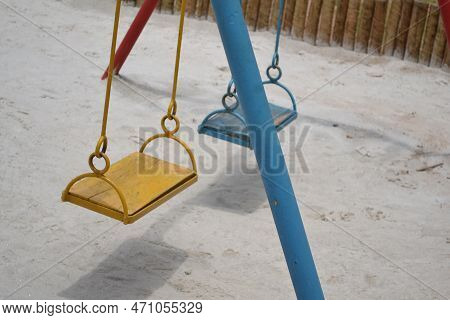Empty Swing Waiting For Kids To Play On Vacation
