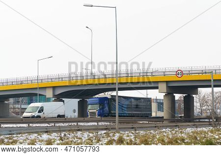 Trucks Drive Under The Transport Bridge. Transport Logistics.