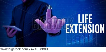Hand Writing Sign Life Extension. Business Concept Able To Continue Working For Longer Than Others O