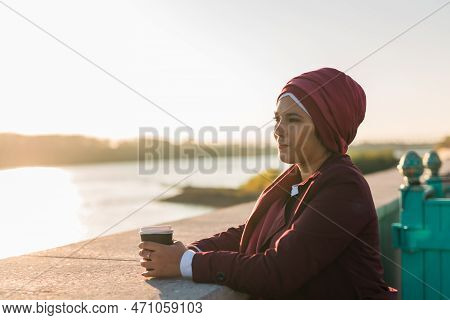 Portrait Arab Woman In Hijab Drinking Coffee In Cafe Outdoors, Copy Space And Empty Place For Text