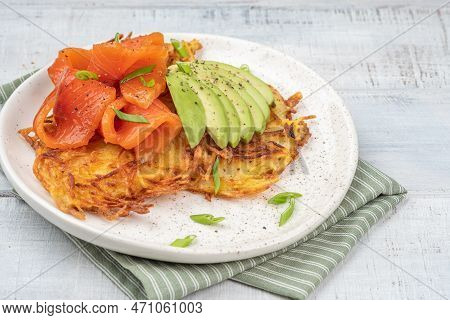 Fried Potato Pancakes With Salmon And Sour Cream, Fritter, Roesti, Golden Crispy Crust. Traditional 