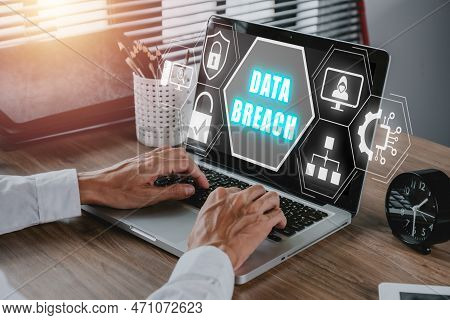 Data Breach Concept, Person Hand Typing Keyboard On Office Desk With Data Breach Icon On Virtual Scr