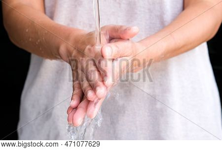 Hands Of Woman Wash Their Hands In A Sink With Foam To Wash The Skin And Water Flows Through The Han