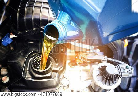 Refueling And Pouring Oil Quality Into The Engine Motor Car Transmission And Maintenance Gear .energ
