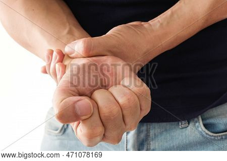 The Young Man Touched His Wrist With His Hand. And He Had Bone And Wrist Pain. From Hard Work
