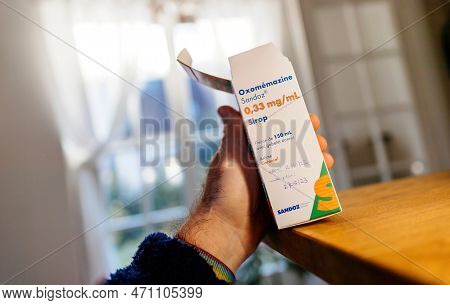 Paris, France - Feb 8, 2023: Pov Male Hand Holding Oxomemazine Pack An Antihistamine And Anticholine