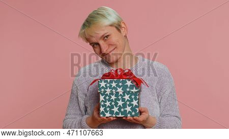 Positive Smiling Woman Presenting Birthday Gift Box Stretches Out Hands, Offer Wrapped Present Caree