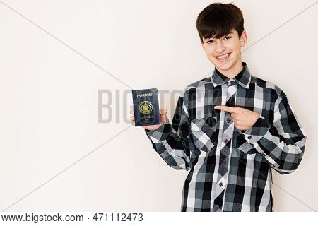Young Teenager Boy Holding Palau Passport Looking Positive And Happy Standing And Smiling With A Con