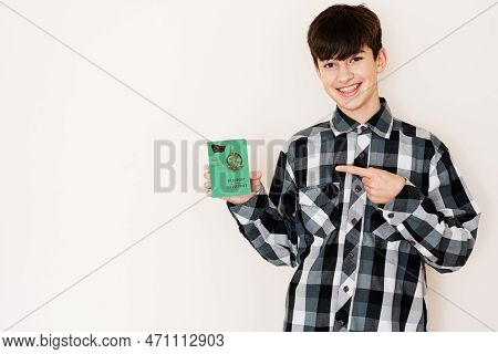 Young Teenager Boy Holding Vanuatu Passport Looking Positive And Happy Standing And Smiling With A C