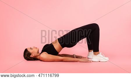 Fitness Concept. Sporty Young Female In Activewear Doing Glute Bridge Exercise
