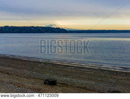 Clouds Cover Mount Rainier Across The Puget Soud In Washington State.