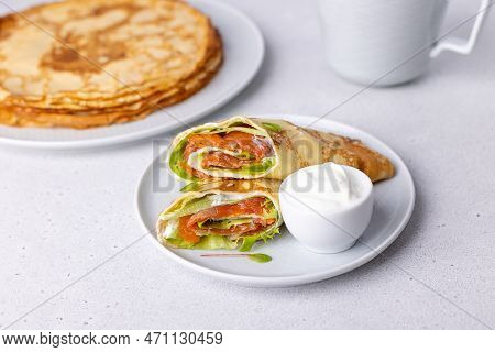 Pancakes With Salmon (trout), Sour Cream And Greenstuff. Thin, Not Sweet Blinchiki Stuffed With Red 
