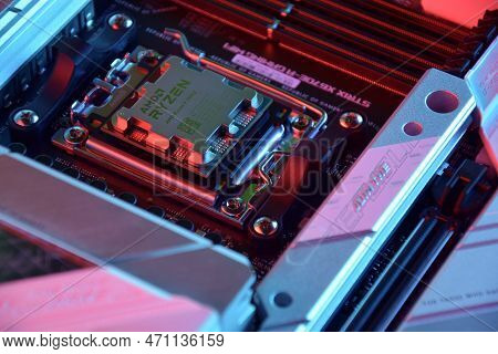 Close-up Of An Amd Ryzen 9 7900X Processor Installed On A Motherboard Asus Rog Strix X670E