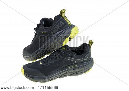 View Of Black Yellow Hoka Sneakers Isolated On White Background. Sweden. Uppsala. 02.20.2023.
