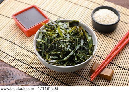Fresh Laminaria (kelp) Seaweed Served On Wooden Table
