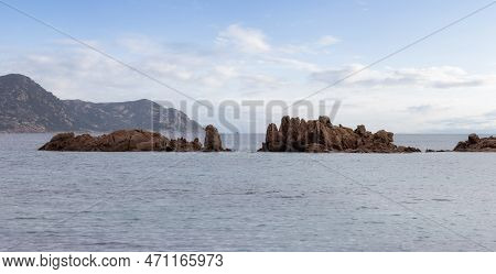 Rocky Coast On The Mediterranean Sea. Punta Don Diego, Sardinia, Italy. Dramatic Sunrise Sky Art Ren