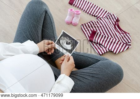 A Pregnant Woman Is Making Recheck And Prepare By Mobile Phone For New Born. Caesarean Section Is A 