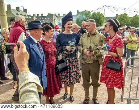 Sainte Mere L'eglise, France - June 6, 2019. Parade Of People Dressed Up In 1940's Clothing Posing I