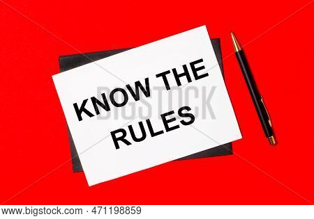 Black Pen, Envelope And White Card With The Text Know The Rules On A Bright Red Background