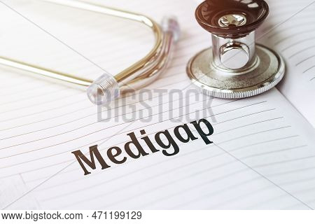 Medigap Text On White Paper On The Medical Background With Stethoscope