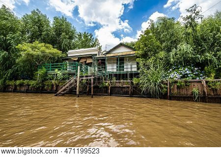 Boat Tour On The Parana Delta, Tigre, Buenos Aires, Argentina. Lush Vegetation, Palm Trees, Construc