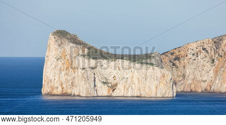 Rocky Cliffs On The Sea Coast. Sardinia, Italy. Nature Background
