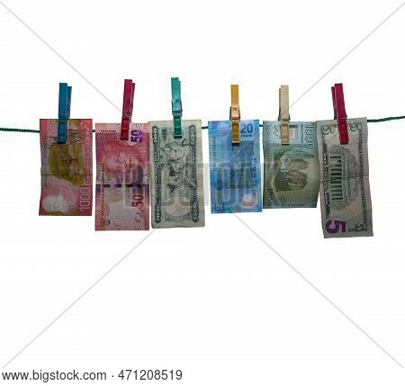 Six Banknotes After Money Laundering To Dry On A Clothesline, Isolated, White Background