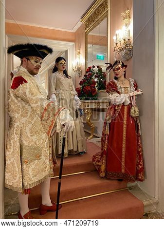Venice, Italy - February 17, 2023: Masqueraded Actors Wait Visitors In Opera House Gran Teatro La Fe