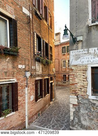 Venice, Italy - February 13, 2023: Old Street With Stone Pavement And Apartment Houses In Sestiere O