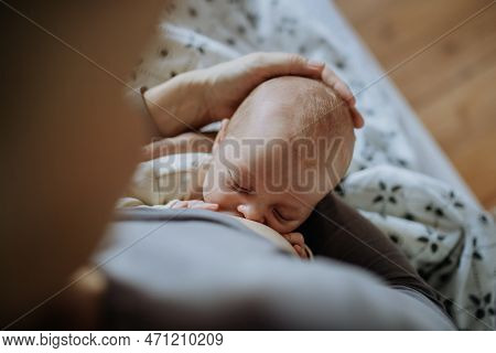 Close-up Of Mother Brestfeeding Her Little Newborn Baby.