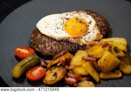 Hacksteak A La Meier Beefsteak With  Fried Eggs And Roasted Potatoes