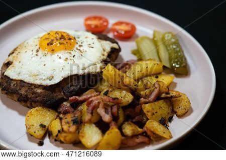 Hacksteak A La Meier Beefsteak With  Fried Eggs And Roasted Potatoes