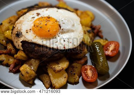 Hacksteak A La Meier Beefsteak With  Fried Eggs And Roasted Potatoes