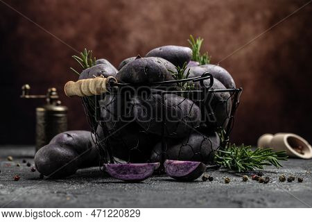 Raw Sweet Potatoes On Wooden Background, Organic Purple Sweet Potato. Raw Sweet Potatoes Or Batatas.