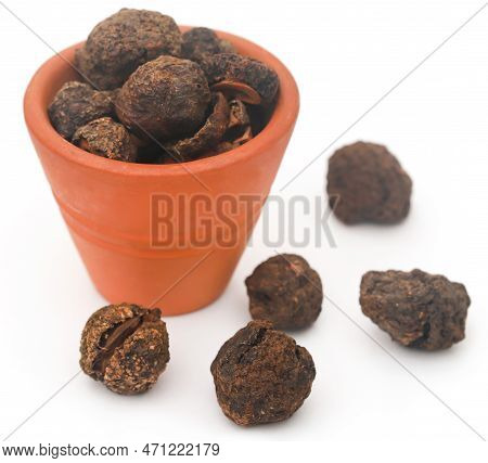 Dried Amla Fruits In Bowl Over White Background
